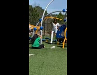 Girl white pants playground kids green shirt