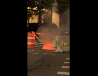 Fire and smoke from manhole street night