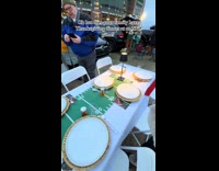 Family celebrates Thanksgiving dinner at NFL game