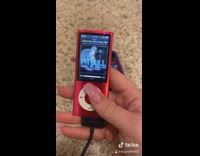 Girl goes through red ipod nano music 