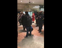 man dressed in white red robe santa