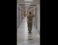 Army guy turns around and salutes empty hallway