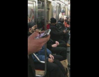 Guy on subway train dressed like cowboy bandit
