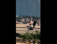 Girl poses edge of mountain road