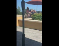 Girl poses wine glass rooftop orange umbrella 