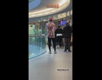 Guy wears shirt with a woman in bikini on it