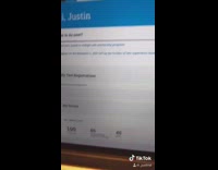 Guy shows perfect test score laptop screen 
