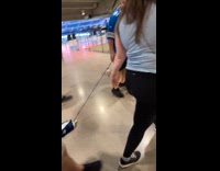 Man pulls skeleton wearing jersey with leash