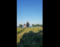 Girl white top sit grass couple kiss