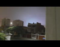 Guy looks out window sees changing lights 