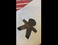 Person attempts to make coffee art cinnamon