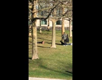 Two men lay on the grass at the park