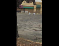 Girl lay on pavement  hat cover face 