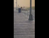 Girl tube top dance video boardwalk foggy