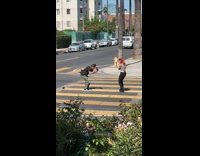 Collab IITW - Woman in a crop top red hair dances in the middle of the road