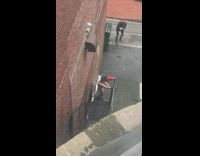 Woman in red leather bikini dance on the alley
