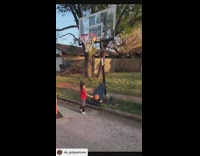Little girl shoots and makes basketball in hoop 