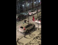 Man red suit freestyle rap snow street