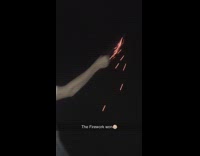 Kid hold lit fireworks fly towards him