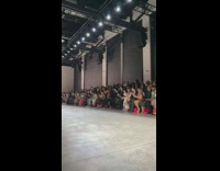 People recording the models at fashion show