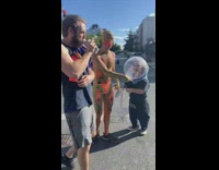 Shirtless guy in body paint yells at pedestrians away from short owner 