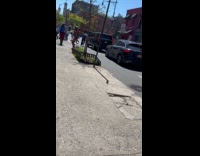 Guy wears underwear rainbow wings on street