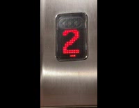 Elevator floor location numbers move upward slowly