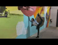 Girl flexible legs wall painting photo shoot