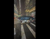 Car Stuck on Top of Road Block