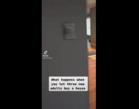 Three guys record themselves sliding on floor and one guy slips