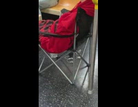 Sleeping guy sits black chair subway train 