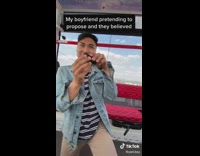 Guy pretends to propose with earbuds case 