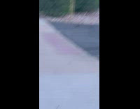 Woman black shirt dance tiktok video empty parking lot