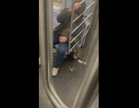 Guy throws up inside the subway train
