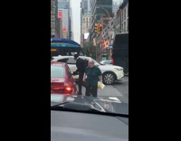 Woman shouts at car blocking the crosswalk