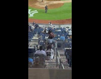 Woman sit pose on rails baseball stadium