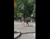 Man with speakerphone pointed to bikers in the street