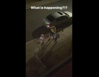 Guys walking down sidewalk have dance break 