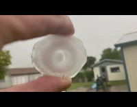 Piece of hail with a circle formed inside