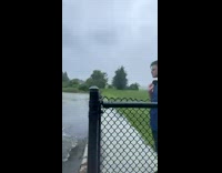 Guy jumps into cold lake 