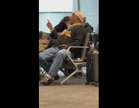 Man Vibes to Music as he Waits