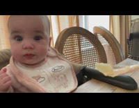 Baby girl spits out pear puree 