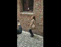 Woman picture gum wall sticks tongue out