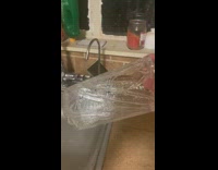 Guy holds ice shape of cup sink 