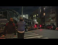 Metal bar truck makes left turn 