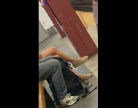 Guy flosses while waiting for train 