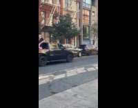 Truck has trump statue at the back 