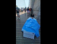 Collab WINY - Woman sleeps on bed at Brooklyn Bridge