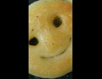 Happy face chicken nuggets cook black pan