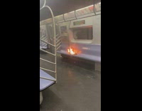 Fire burning on subway seat on empty train